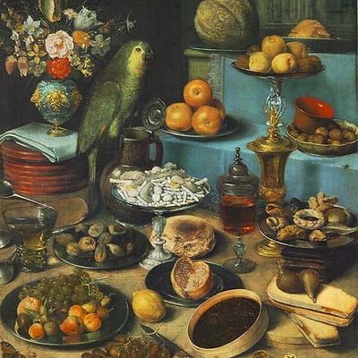 Still life with fruit and a richly laid table